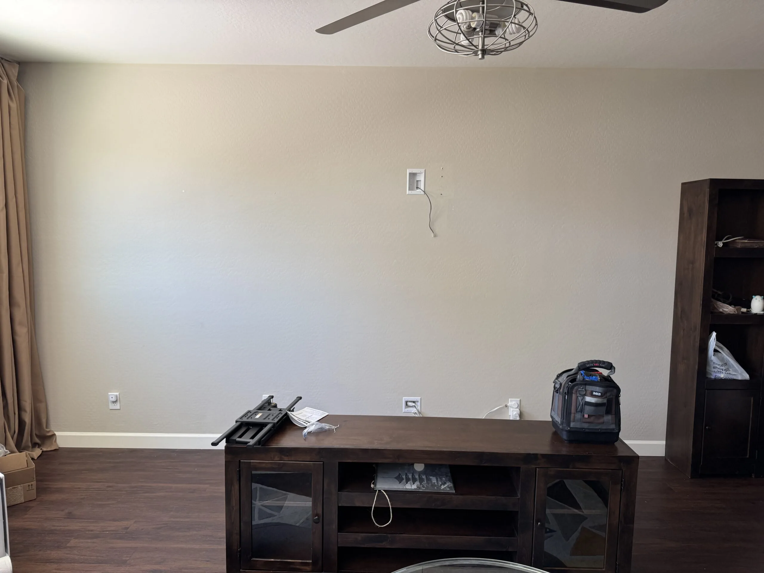 Before: TV Mounted Above Entertainment Center